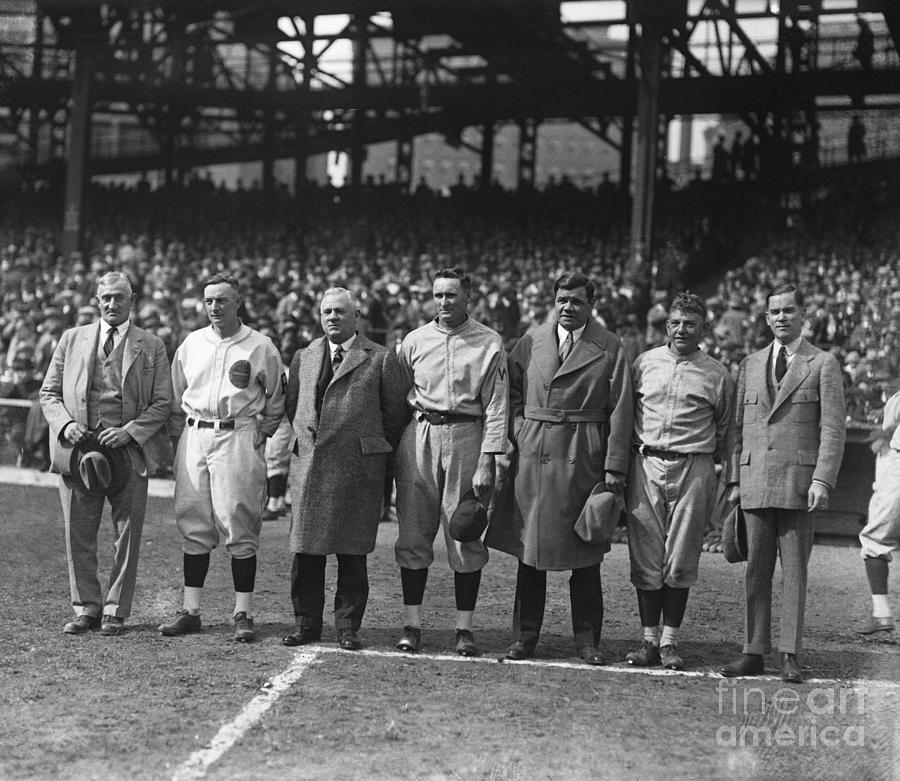 Baseball Players Standing In Stadium Photograph by Bettmann