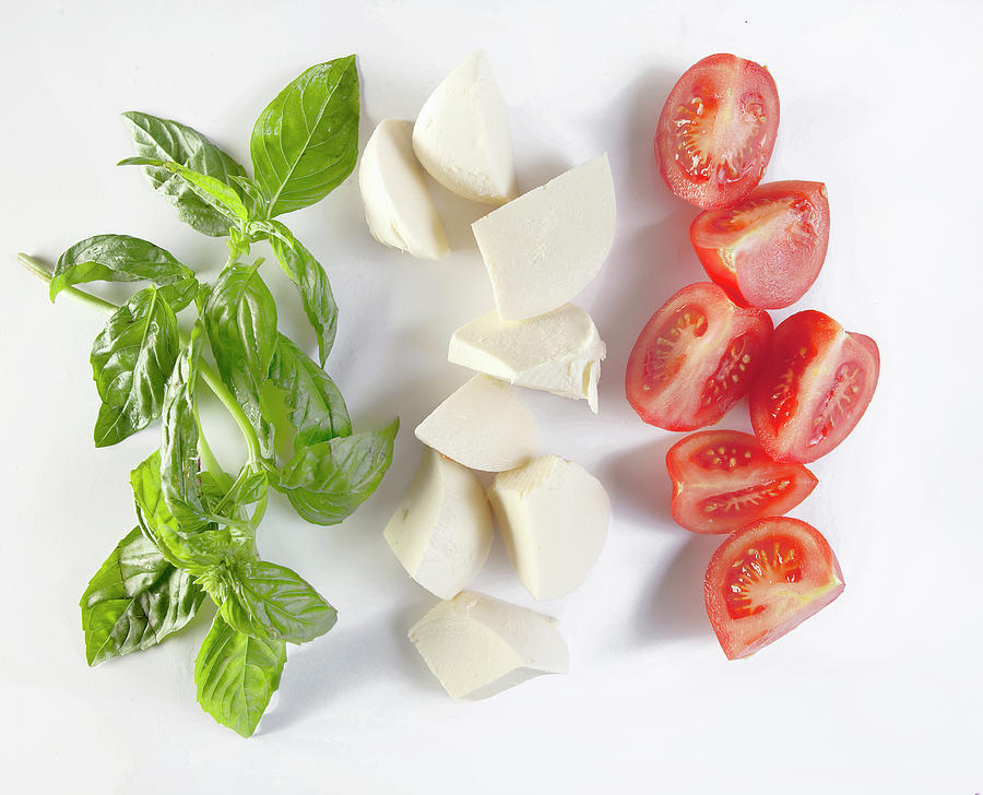 Basil, Mozzarella And Tomato Wedges shaped As Italian Flag Photograph by Trudy Kelder