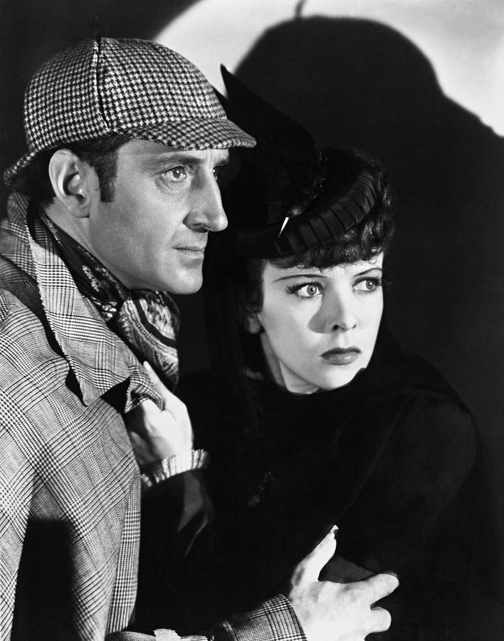 BASIL RATHBONE and IDA LUPINO in THE ADVENTURES OF SHERLOCK HOLMES -1939-. Photograph by Album