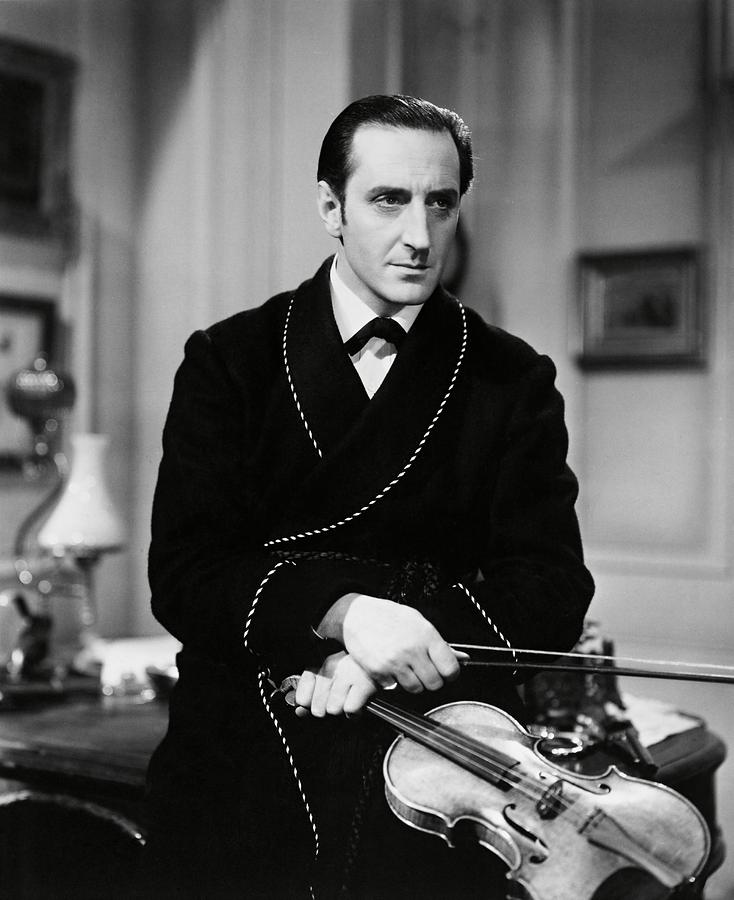 Sherlock Holmes Photograph - BASIL RATHBONE in THE HOUND OF THE BASKERVILLES -1939-. by Album
