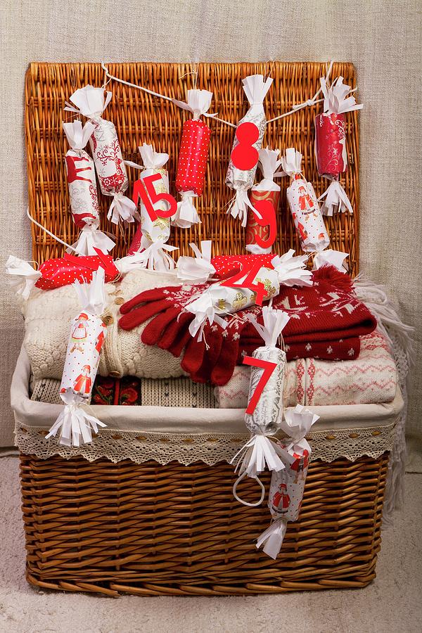 Basket Containing Winter Clothing And An Advent Calendar Photograph by Monika Halmos