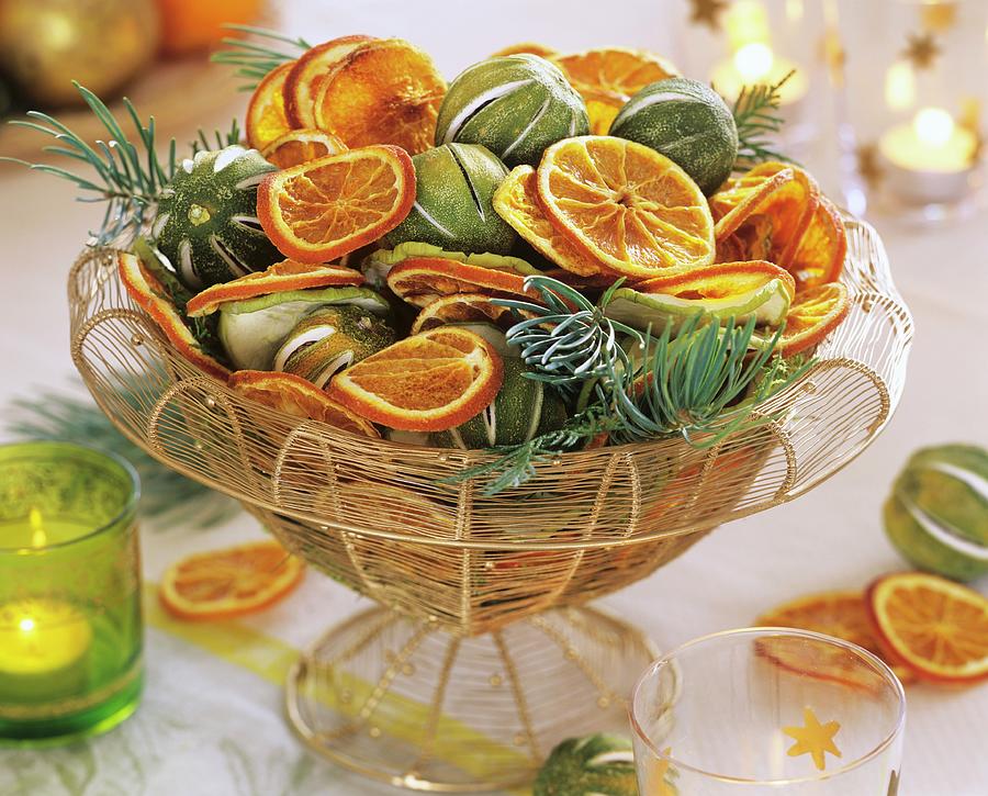 Basket Of Dried Citrus Fruits Photograph by Friedrich Strauss