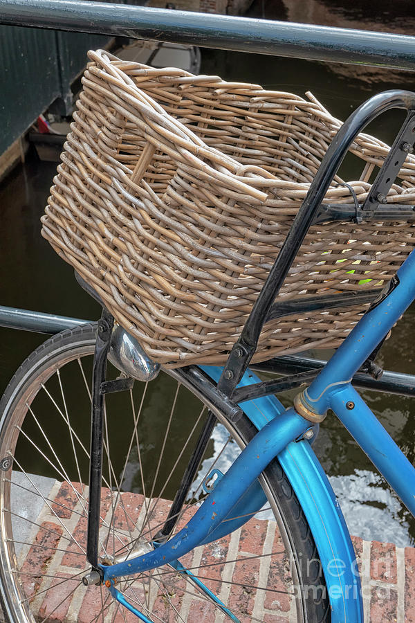 Basket on blue bike Photograph by Patricia Hofmeester