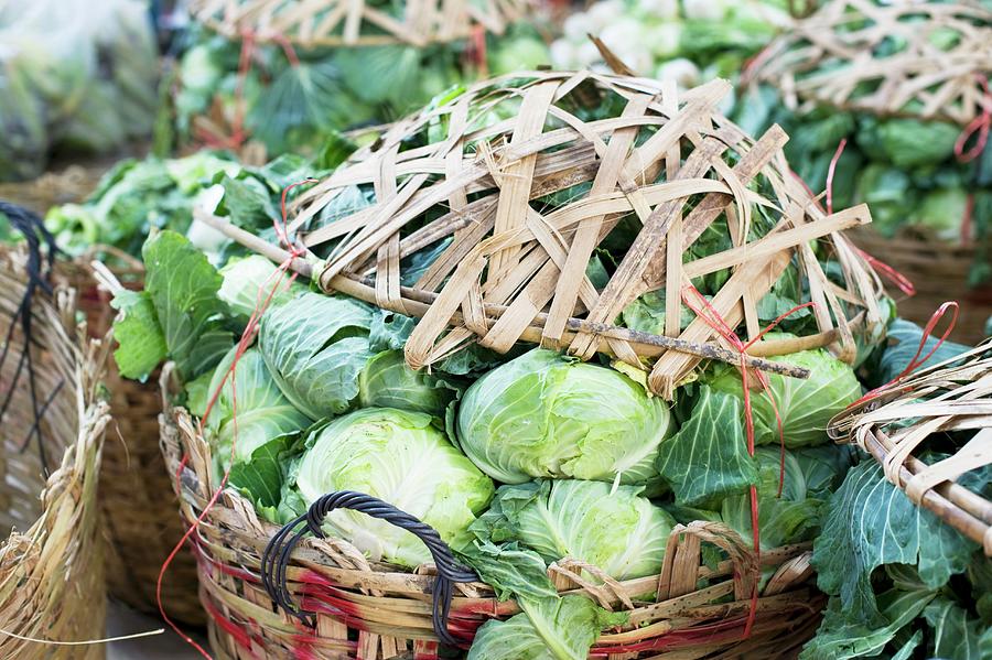 Baskets Of Cabbages At A Market In China Town, Bangkok, Thailand Photograph by Achim Sass