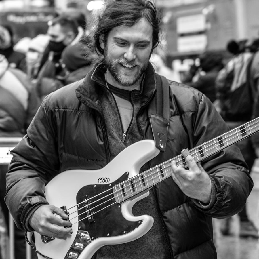 Chicago Photograph - Bass Guitarist At Christkindlmarket by Keith Yearman