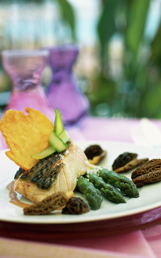 Bass With Asparagus And Morels Photograph by Caillaut