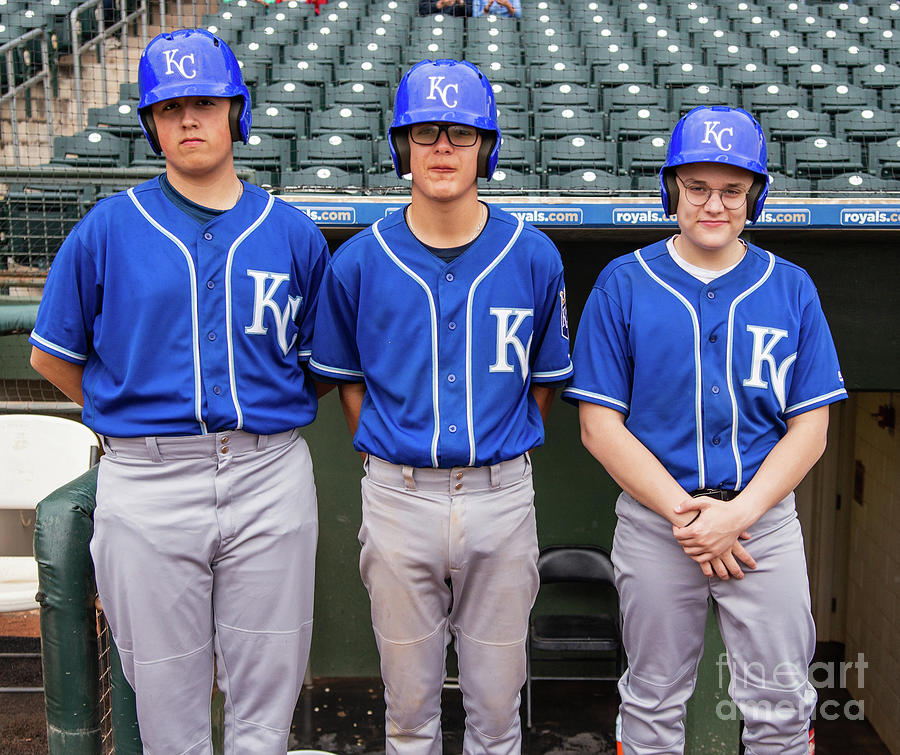 Bat boys pose in front of dugout Photograph by Randy Jackson
