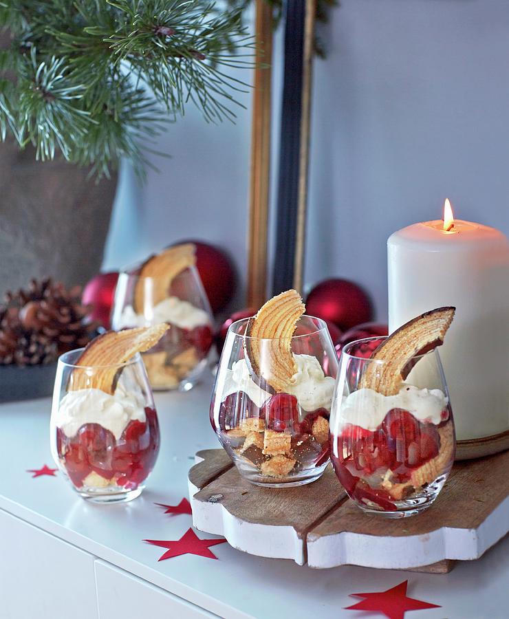 Baumkuchen german Layer Cake And Cherry Trifle In Desert Glasses For Christmas Photograph by Jalag / Julia Hoersch