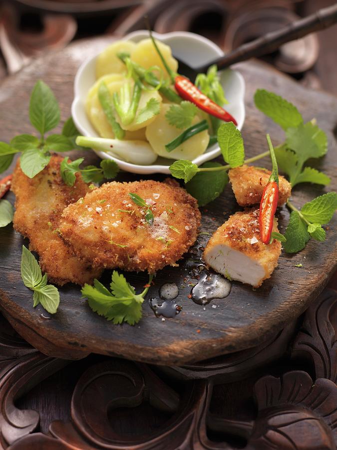 Bavarian Fried Chicken On A Thai Potato Salad Photograph by Eising Studio - Food Photo & Video