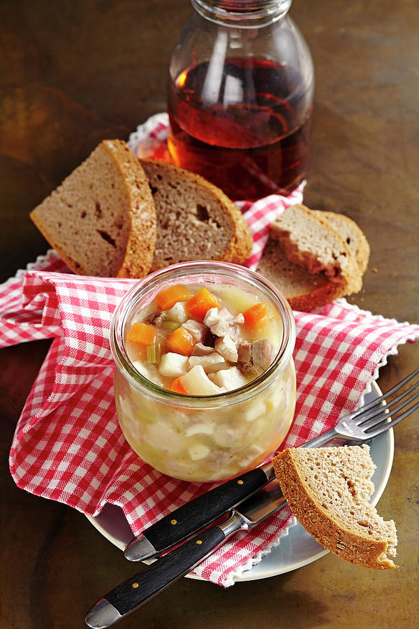 Bavarian Kncherl: Pork Trotter Stock In A Mason Jar, With Bread Photograph by Teubner Foodfoto