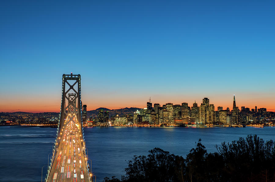 Bay Bridge And San Francisco Skyline At Photograph by Thomas Winz