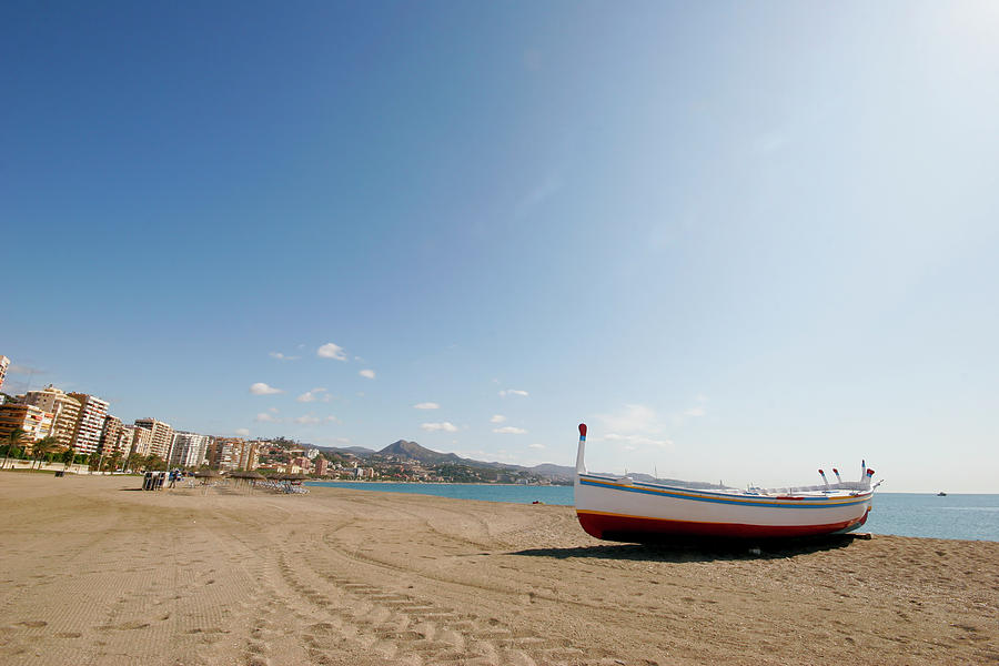 Beach And Boat In Malaga Photograph by Cirilopoeta