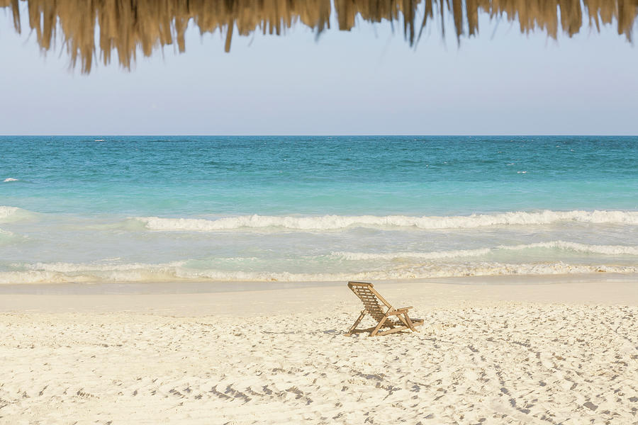 Beach Chair On Beach Next To Ocean Photograph by Sasha Weleber