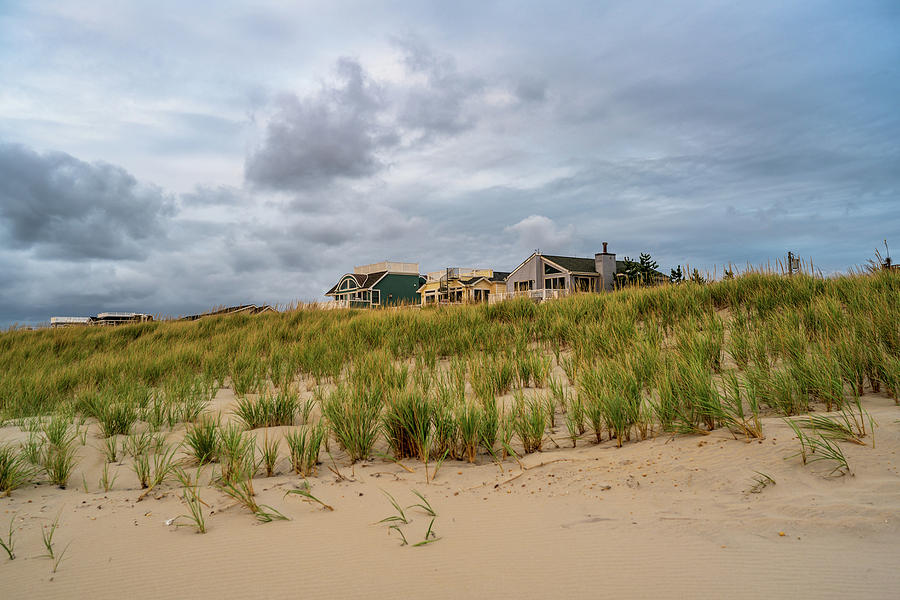 Fall Photograph - Beach Houses under a Cloudy Sky by Joe Benning