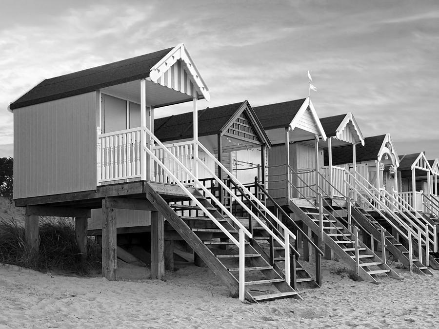 Beach Huts Sunset In Black And White Photograph by Gill Billington