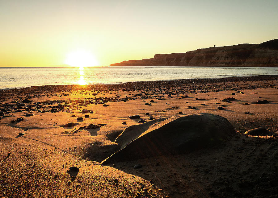 Warm Coastal Sunrise On The Beach Of Hawkes Bay In New Zealand Photograph by Peter Kolejak