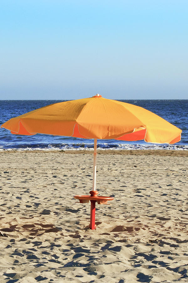 Beach Umbrella In The Sand by Geri Lavrov