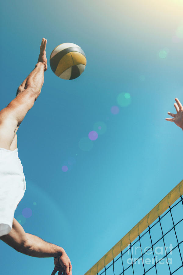 Beach Volleyball Player About To Hit The Ball Photograph by Microgen Images/science Photo Library