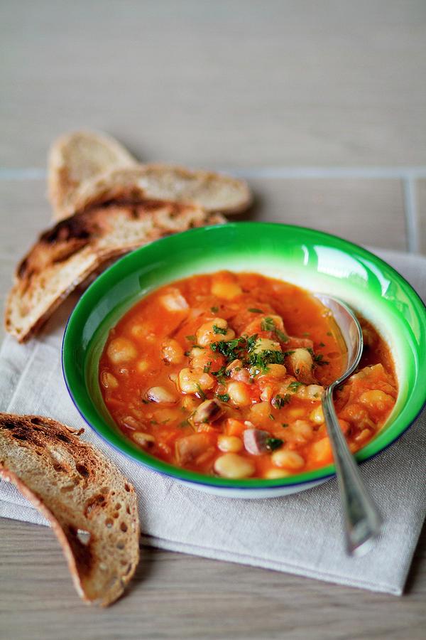 Bean And Chickpea Stew With Toasted Bread Photograph by Maas Aldaya, Alicia
