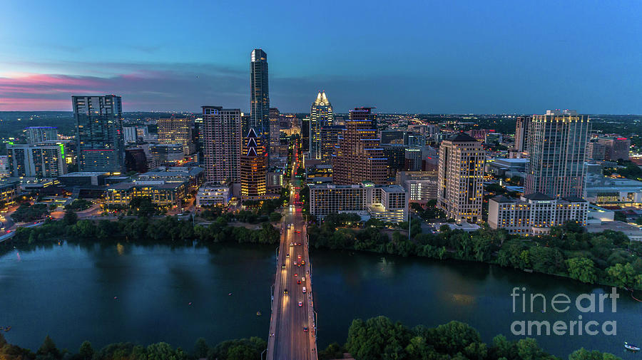 Sunset Photograph - Beautiful aerial view of the Congress Avenue Bridge overlooking downtown Austin highrise skyscrapers into the Texas State Capitol by Dan Herron