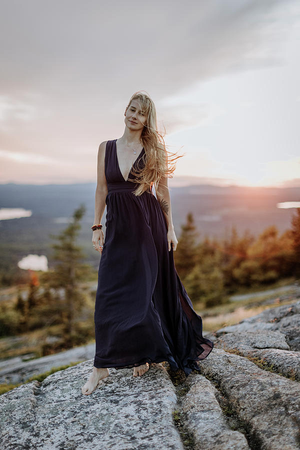 Nature Photograph - Beautiful Blonde Woman Barefoot In Long Dress With Tattoo At Sunset by Cavan Images / Chris Bennett