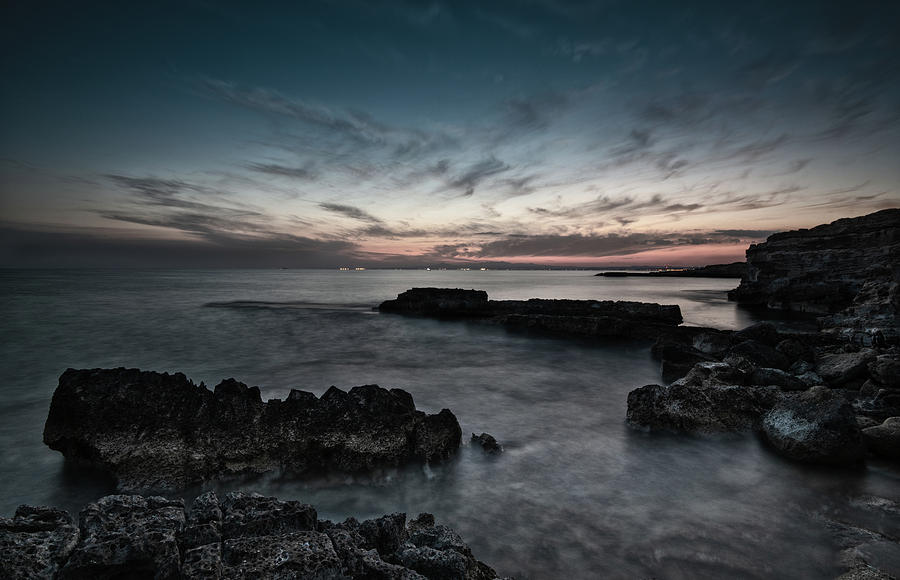 Beautiful dramatic Sunset on a rocky coastline Photograph by Michalakis Ppalis