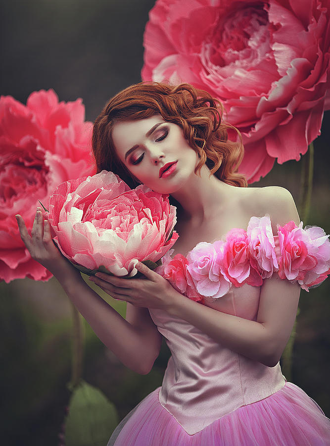 Beautiful girl with red hair near giant peony pink flowers. The girl is a  flower princess. by Marina Zharinova