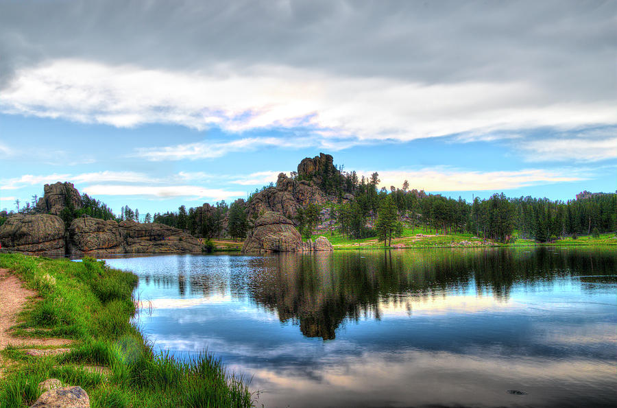 Beautiful reflection at Sylvan Lake  Photograph by Dan Friend