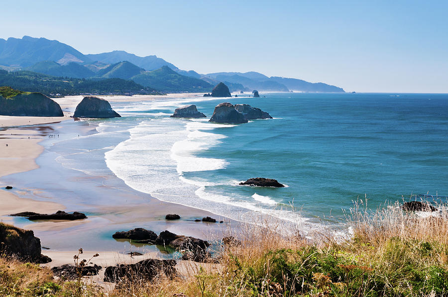 Beautiful View Of Cannon Beach In The Photograph by Andreygatash
