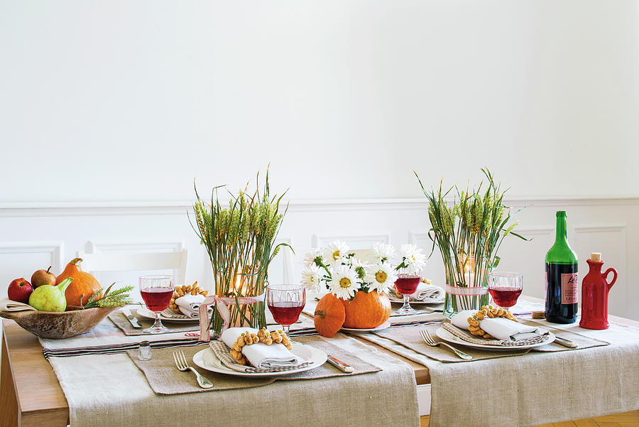 Beautifully Decorated Table With Crockery And Wine Glasses Photograph by Jalag / Gaby Zimmermann