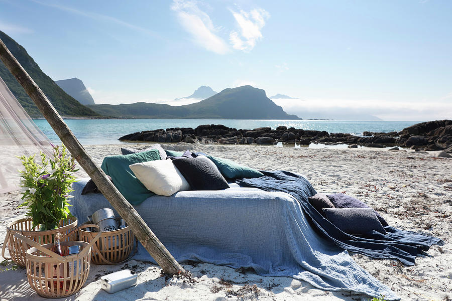 Bed Linen And Pillows In Shades Of Blue On Bed Next To Baskets On Beach Photograph by Annette Nordstrom