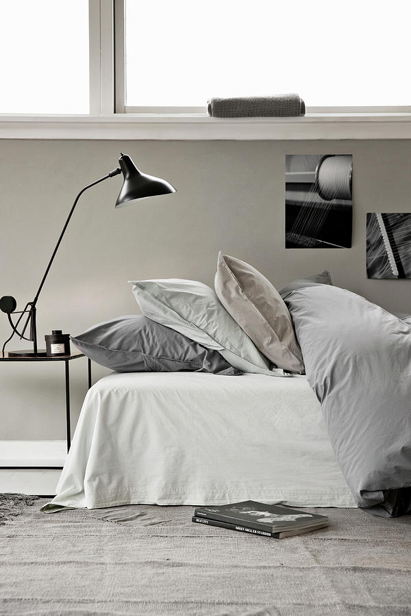 Bed With Duvet And Pillows, Bedside Table With Reading Lamp Photograph by Lykke Foged & Morten Holtum