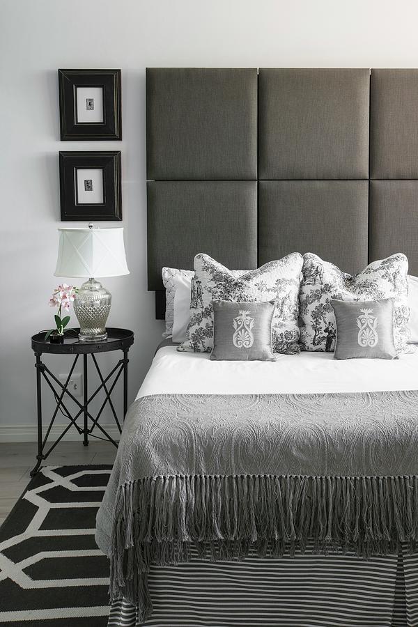 Bed With Upholstered Headboard In Elegant Bedroom In Shades Of Grey Photograph by Great Stock!