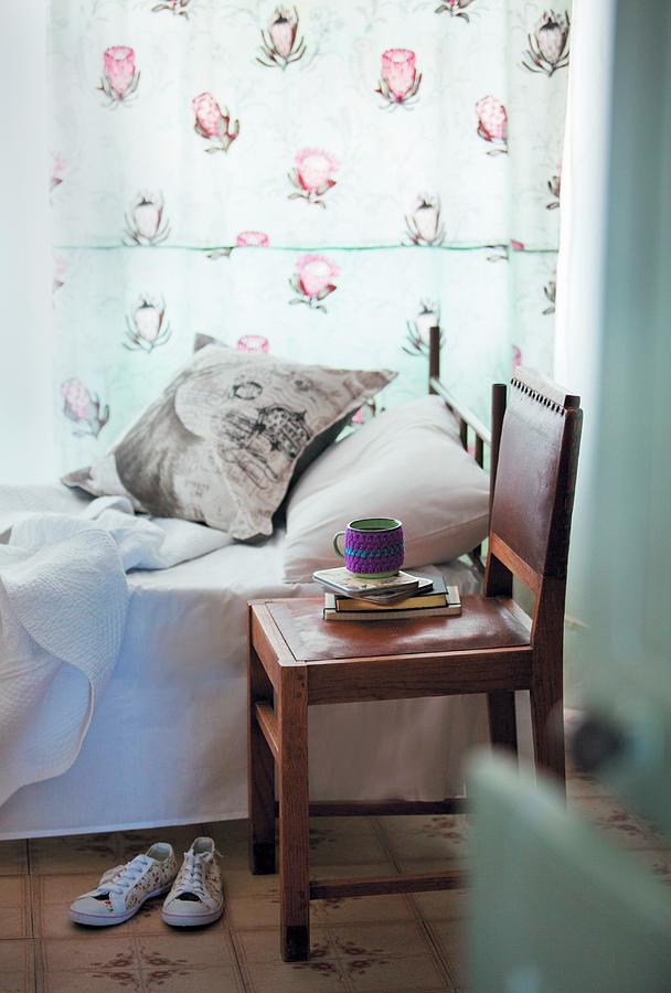Bedroom With Single Bed, Floral Curtain, Scatter Cushion And Leather Chair As Bedside Table Photograph by Great Stock!