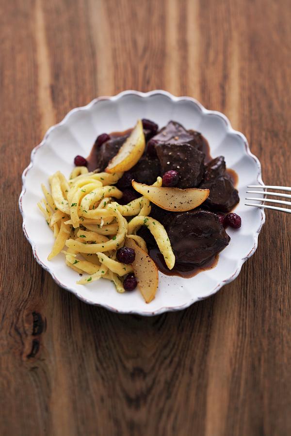 Beef Bourguignon With Spaetzle Noodles, Pear And Cranberries Photograph by Michael Wissing