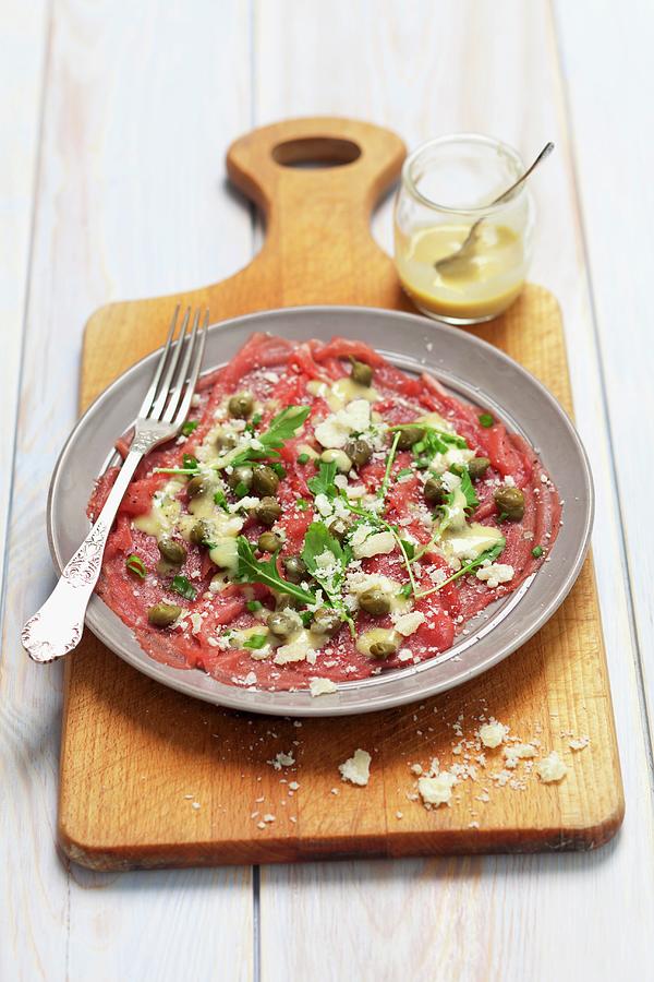 Beef Carpaccio With Mustard Dressing, Capers And Parmesan Cheese Photograph by Rua Castilho