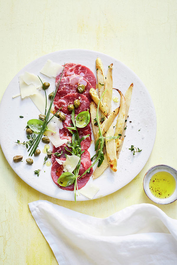 Beef Carpaccio With Roasted White Asparagus And Rocket Photograph by Stockfood Studios /  Thorsten Suedfels
