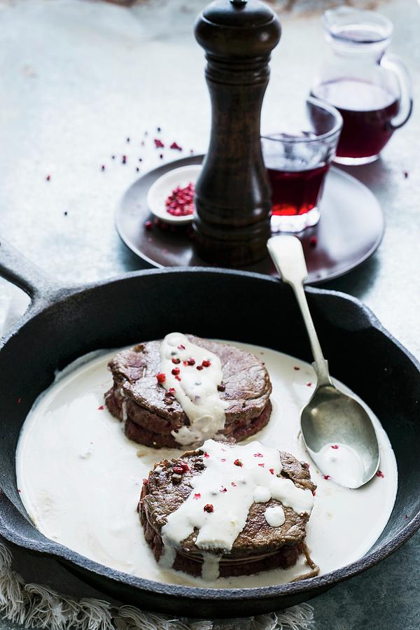 Beef Fillet With A Creamy Sauce And Pink Peppercorns In A Pan Photograph by Maricruz Avalos Flores