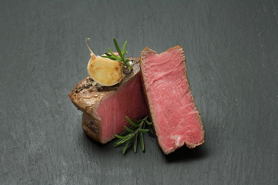 Beef Fillet With Garlic And Rosemary Photograph by Sandra Eckhardt
