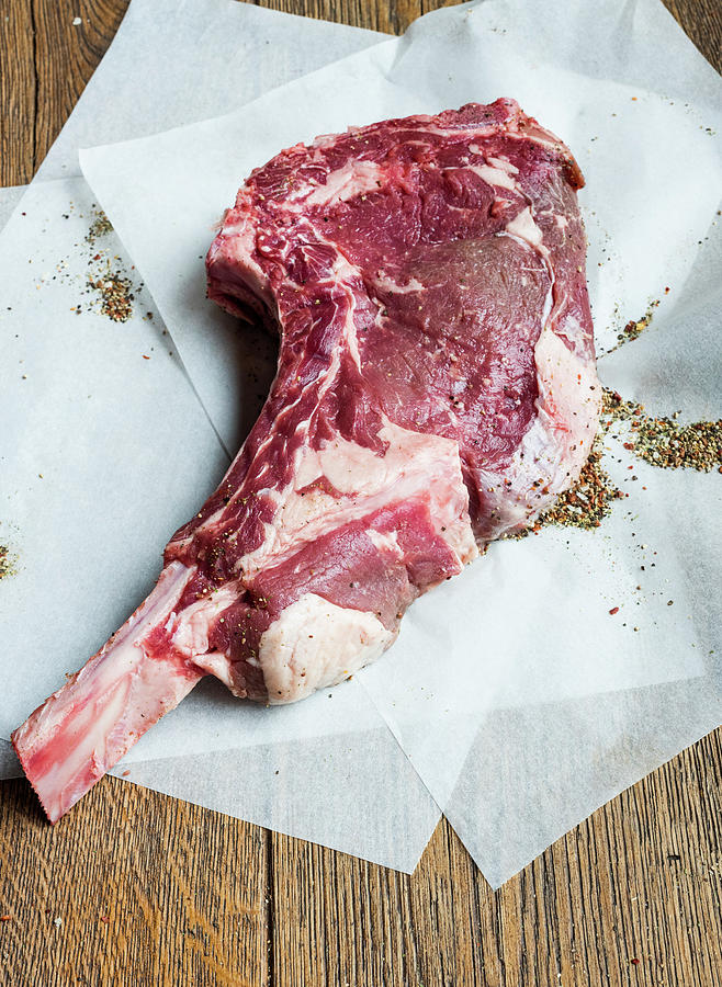 Beef Rib Eye Steak With Bone Photograph by Vulman Pter