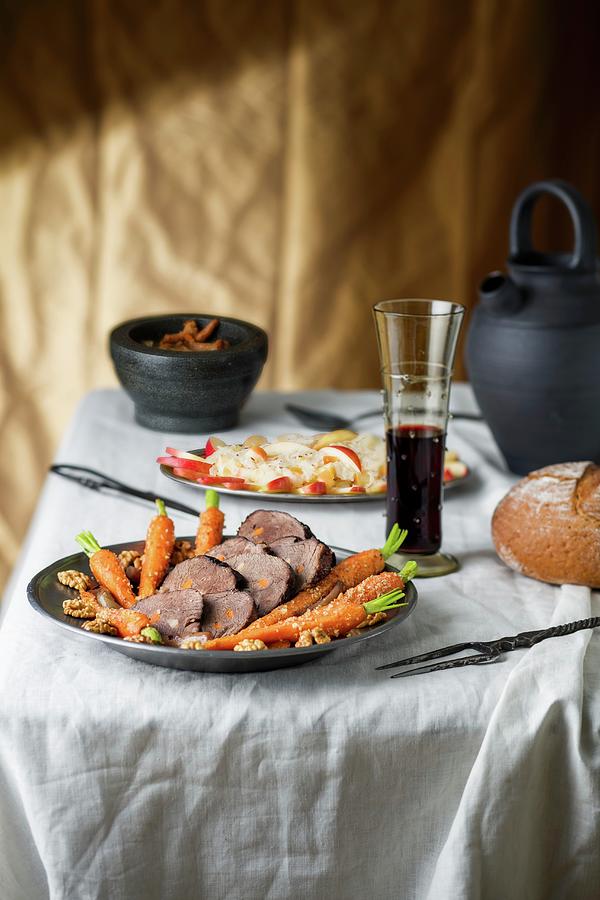 Beef Roast With Carrots In A Restaurant Photograph by Jan Prerovsky