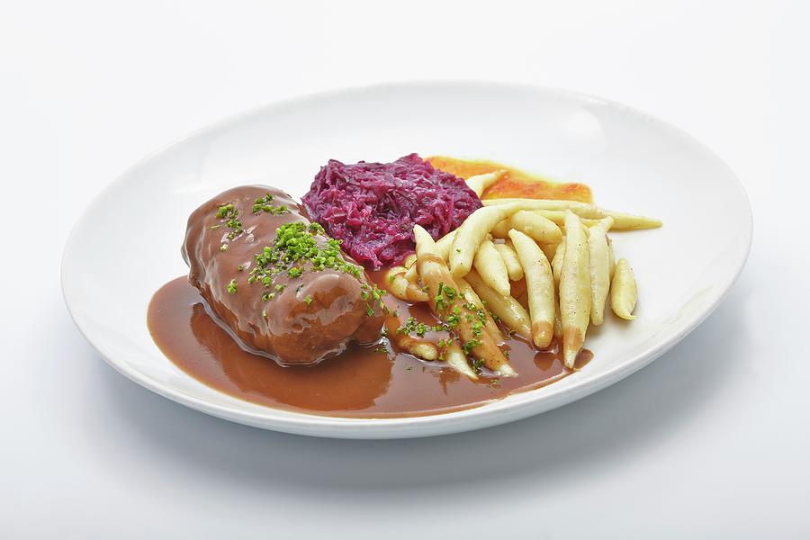 Beef Roulade With Potato Orzo Pasta And Red Cabbage Photograph by Karl Stanzel