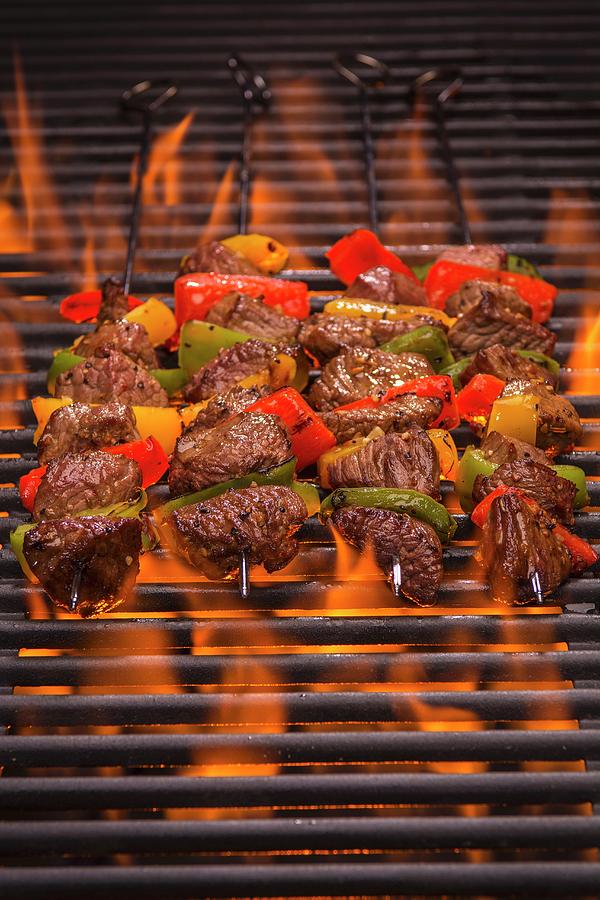 Beef Skewers With Peppers On A Flaming Grill Photograph by Brian Enright