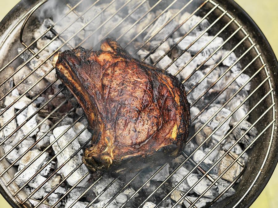 Beef Steak On A Barbecue seen From Above Photograph by Hugh Johnson