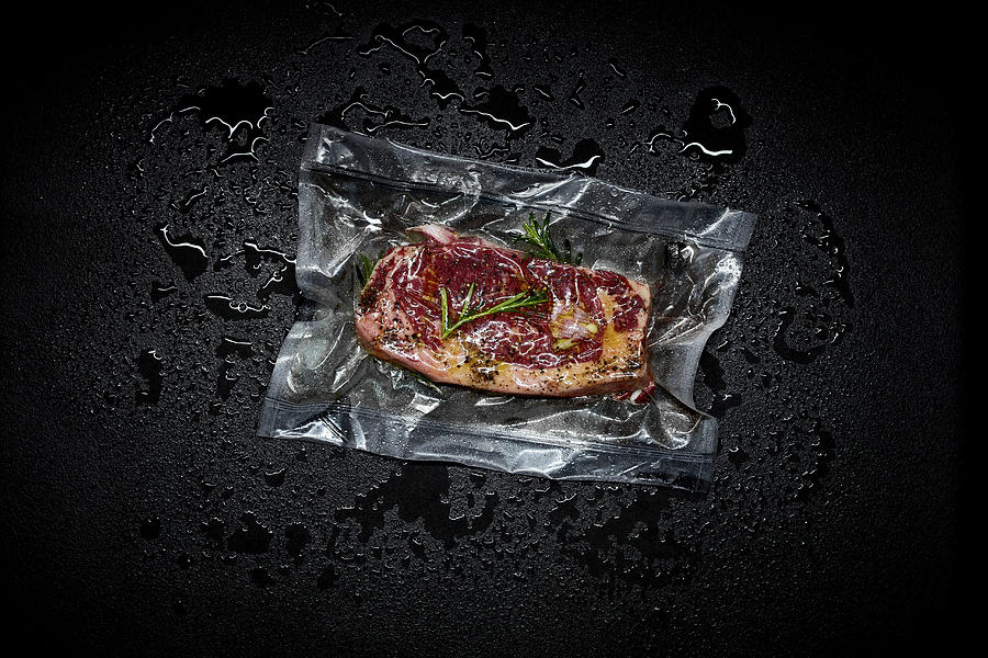 Beef Steak With Herbs In A Sous Vide Bag Photograph by Maximilian Carlo Schmidt
