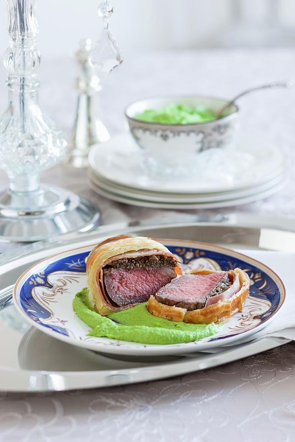 Beef Wellington On A Bed Of Mushy Peas And Mashed Potato Photograph by Andrew Young