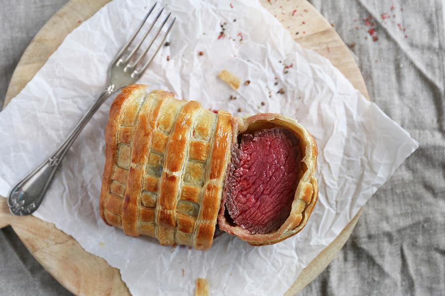 Beef Wellington, Sliced, On A Piece Of Paper seen From Above Photograph by Eva Lambooij