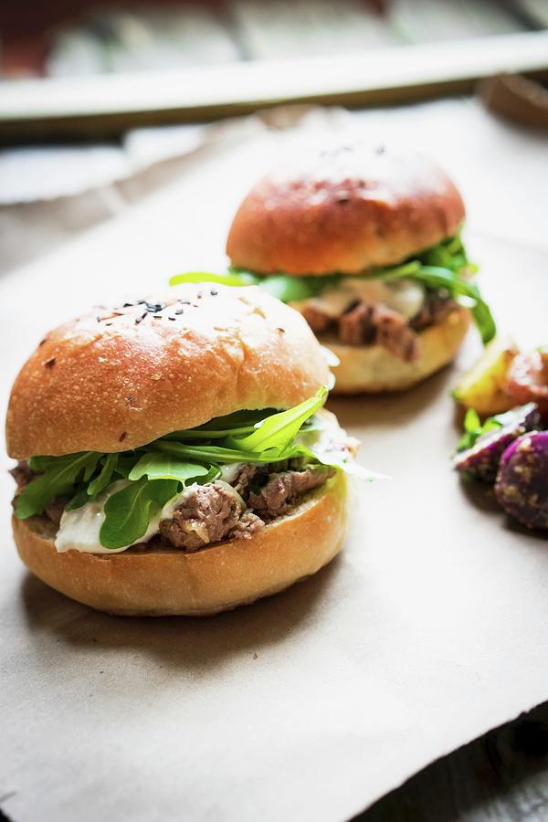 Beefburgers With Cheese And Rocket Photograph by Alena Haurylik