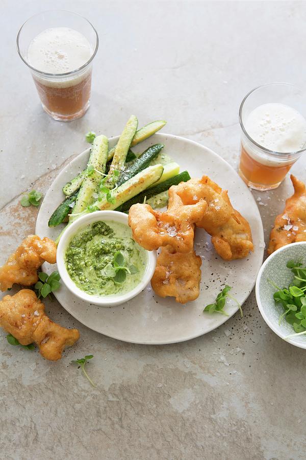 Beer-battered Fish Nuggets With Fried Baby Courgettes And Pesto And Sour Cream Sauce Photograph by Great Stock!