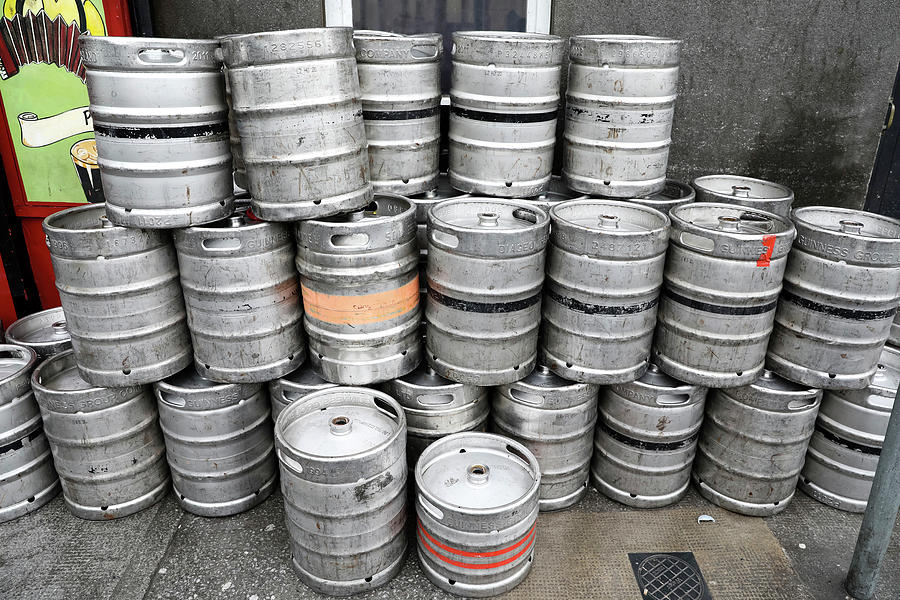 Beer Kegs Stacked Up Against Wall In Galway, Ireland Photograph by
